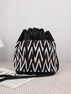 The Chic Black and White Woven Bucket Bag is the perfect accessory for busy moms on the go. With its stylish design and ample storage space, it's the ideal bag for both travel and daily use. Crafted with expert precision, this bag is both chic and functional, making it a must-have for any mom.