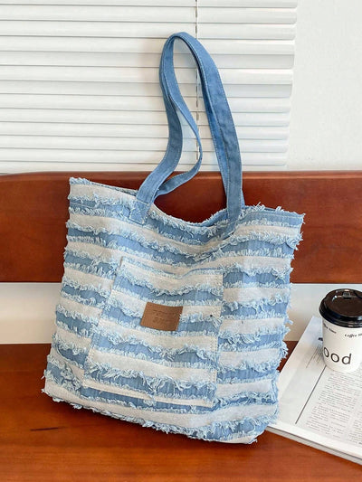 Introducing the Striped Patch Shoulder Tote - the ultimate casual commuting bag! With its striped patch design, this tote is perfect for everyday use, whether for work or casual outings. It's the perfect combination of style and functionality, making it the must-have bag for any busy individual on the go.
