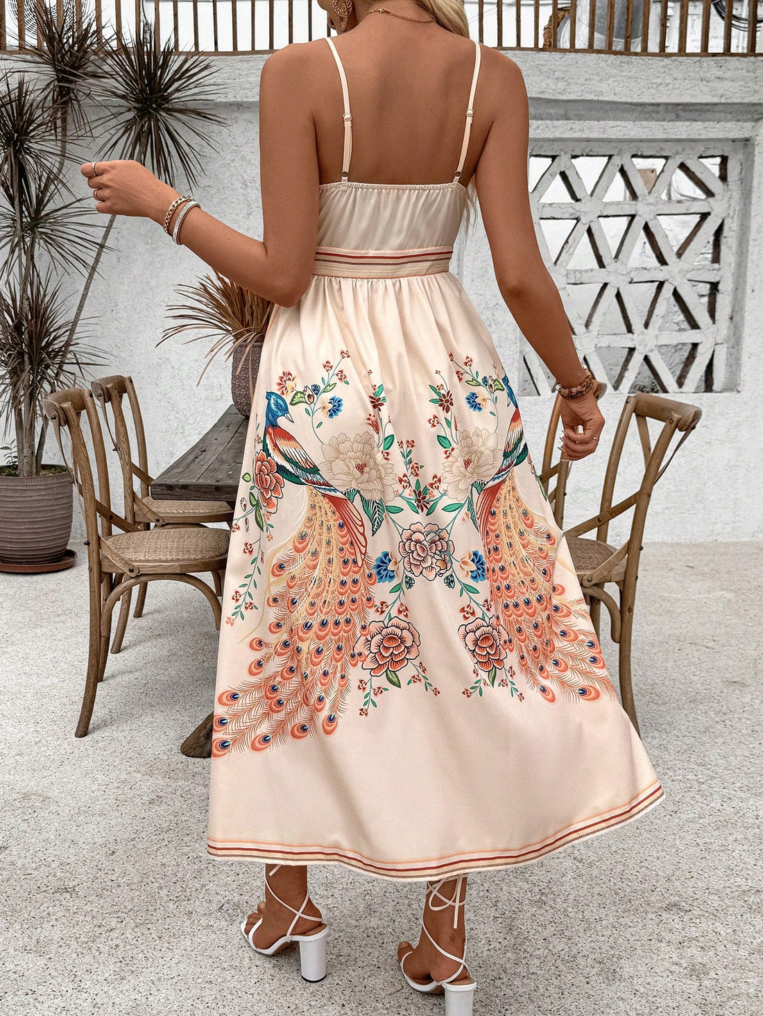 Introducing Peacock Paradise: Women's Vintage Style Strappy Dress. Embrace timeless elegance with this stunning dress featuring intricate strappy details and a vintage peacock print. Made with high-quality materials, this dress is perfect for any occasion. Elevate your wardrobe with this must-have dress.