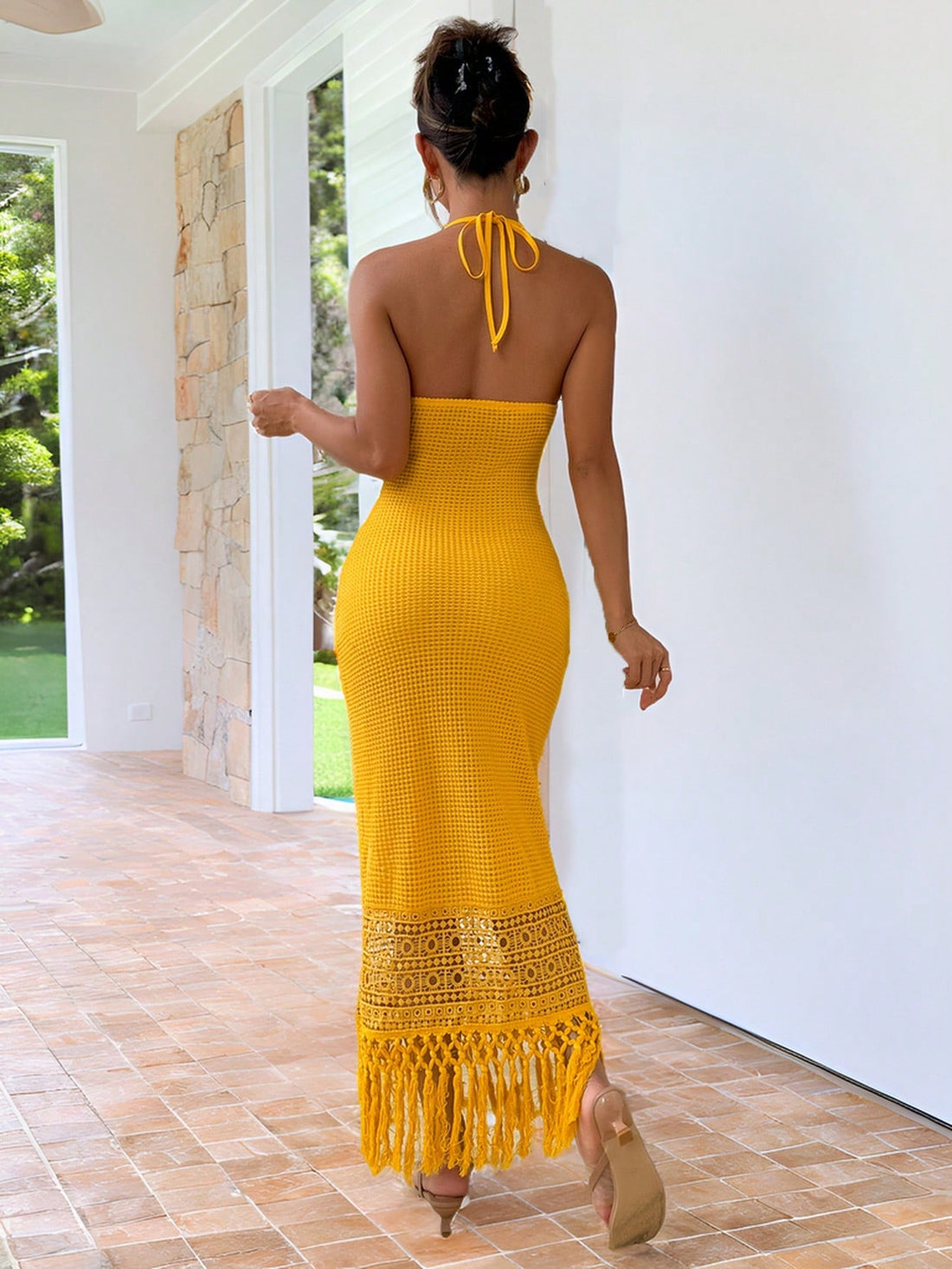 Get ready for some effortless vacation vibes with our Chic Tassel Hem Halter Neck Dress! Made with a stylish tassel hem and halter neckline, this dress is perfect for any getaway. So why not add a touch of chic to your vacation wardrobe? (And maybe a few Instagram photos too!)