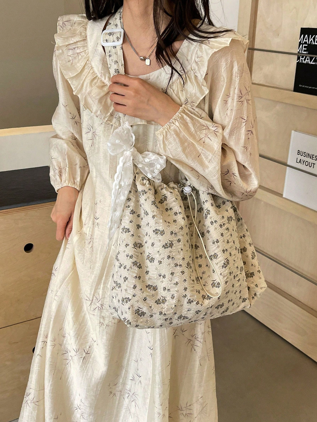 This White Floral Bucket Bag Tote is perfect for students and trendsetters alike. Its spacious design allows for all your essentials while the stylish floral pattern adds a touch of elegance. Crafted with durable materials, this bag is built to last. Stay organized and on-trend with this must-have tote.