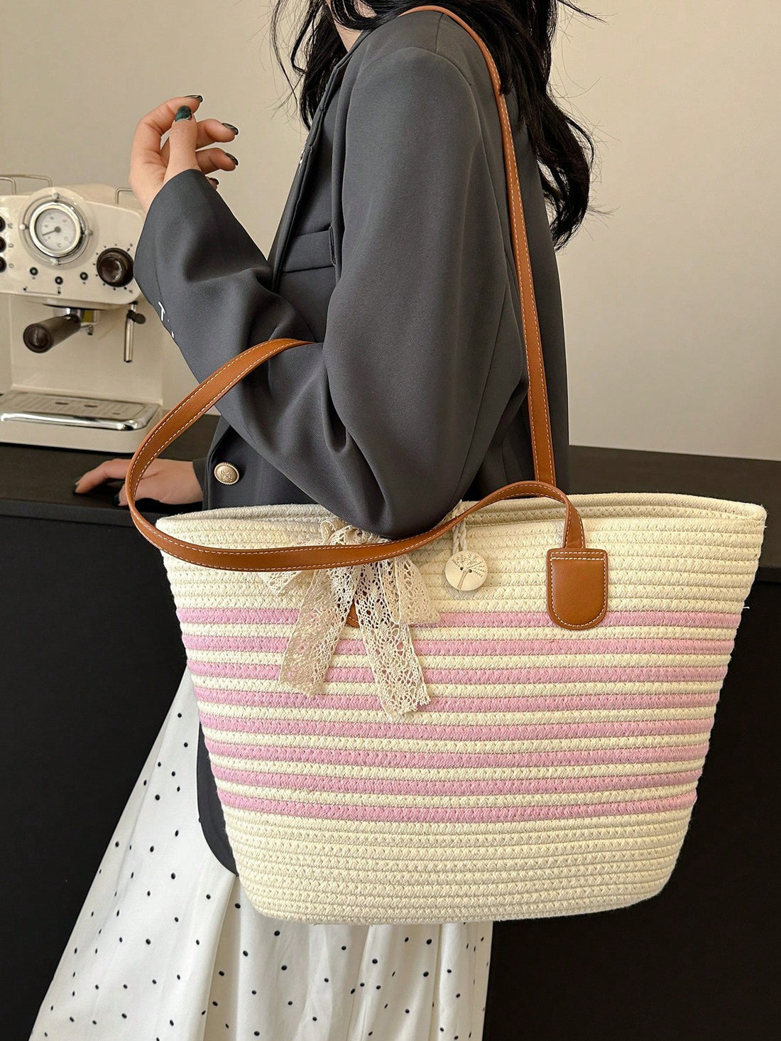 Expertly crafted with a stylish color block design, this chic woven shoulder bag is a must-have for fashionable women. Its spacious interior and sturdy straps make it the perfect accessory for everyday use. Elevate your style with this statement tote.