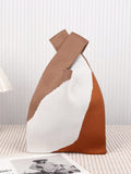 Elevate your style with our Chic and Practical Knitted Mesh Tote Bag Wristlet for Women. Made with durable mesh material, this tote bag is both stylish and functional, perfect for carrying your essentials. The knitted design adds a touch of sophistication, making it a must-have accessory for any fashion-forward woman.