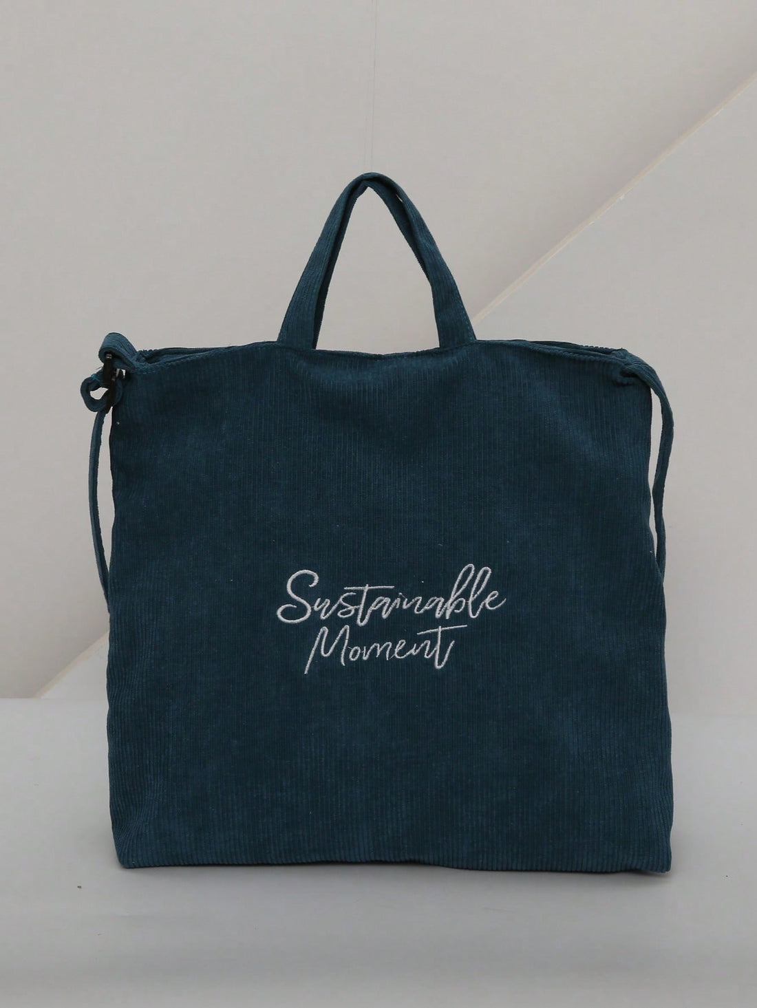 Introducing our Stylish Vintage Corduroy Shoulder Bag, the perfect addition to your fashion-forward wardrobe. Crafted with lightweight material, this trendy tote offers both style and practicality. Elevate your shopping experience with this must-have accessory.