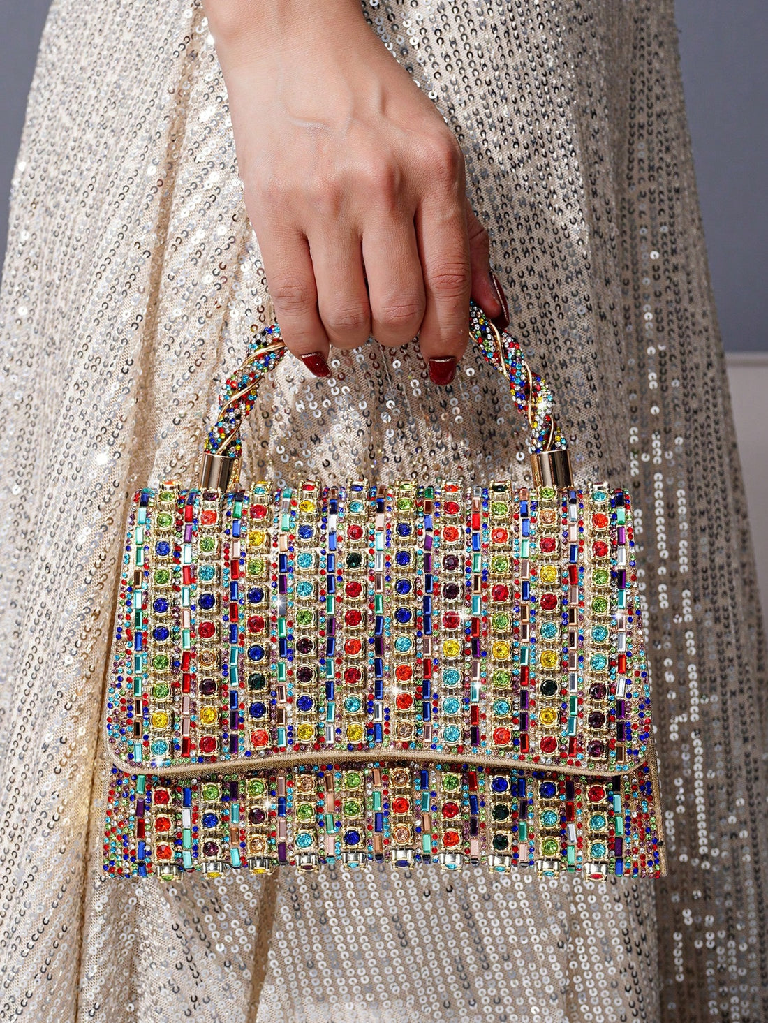Introducing the Sassy Sparkle Clutch Bag, perfect for adding a touch of glamour to your evening attire. This stylish clutch features colorful rhinestones for a sparkling effect. Stand out from the crowd and elevate your look with this stunning accessory.