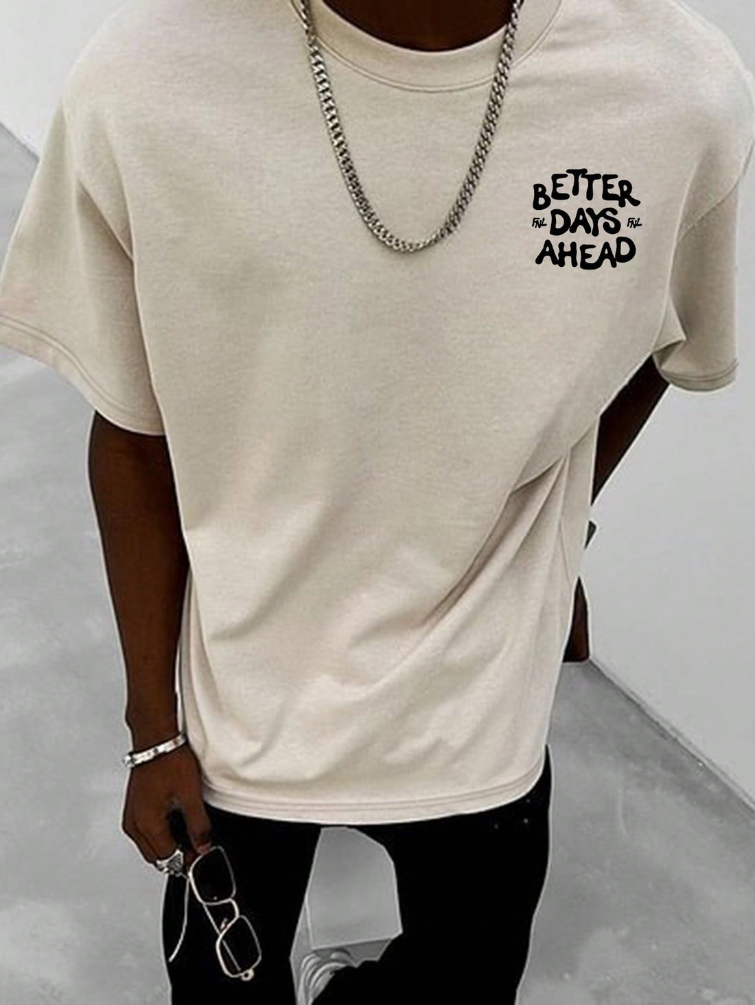This Graphic Drop Shoulder T-Shirt features a bold slogan and face print, adding a touch of personality to your wardrobe. Made with high-quality material, it offers both comfort and style. Show off your unique sense of fashion with this statement t-shirt.