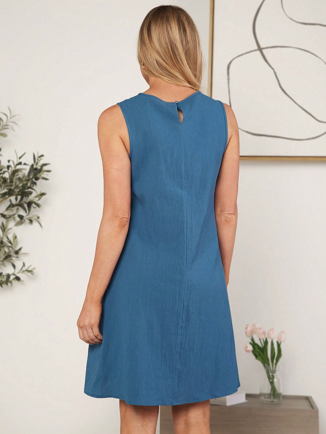 Get the best of both worlds with our Chic & Classic: Wildara Women's Dress! This solid color dress features unique button-detailing and convenient dual pockets. Look stylish and stay organized while rocking this trendy dress.