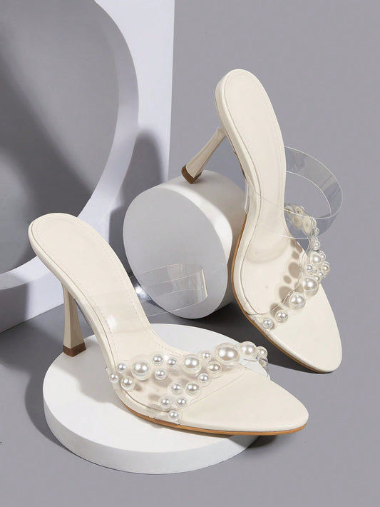 Indulge in elegance with our Dazzling White Pearl Ankle Strap Stiletto High Heel Sandals. Crafted with stunning pearls and a classic ankle strap, these sandals are the perfect addition to any occasion. With a stiletto heel, they provide both style and comfort. Elevate your look today.