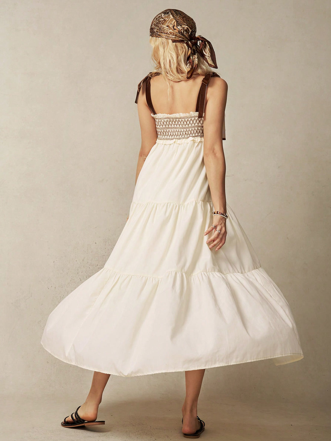 Enhance your summer wardrobe with our Boho Dreams dress. This women's strappy dress features intricate braided detailing for a touch of elegance. Made with high-quality materials, it's perfect for any occasion. Embrace the bohemian trend and stand out in this unique and stylish dress.