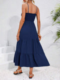 Back view navy smocked tiered maxi sundress with gathered tiers