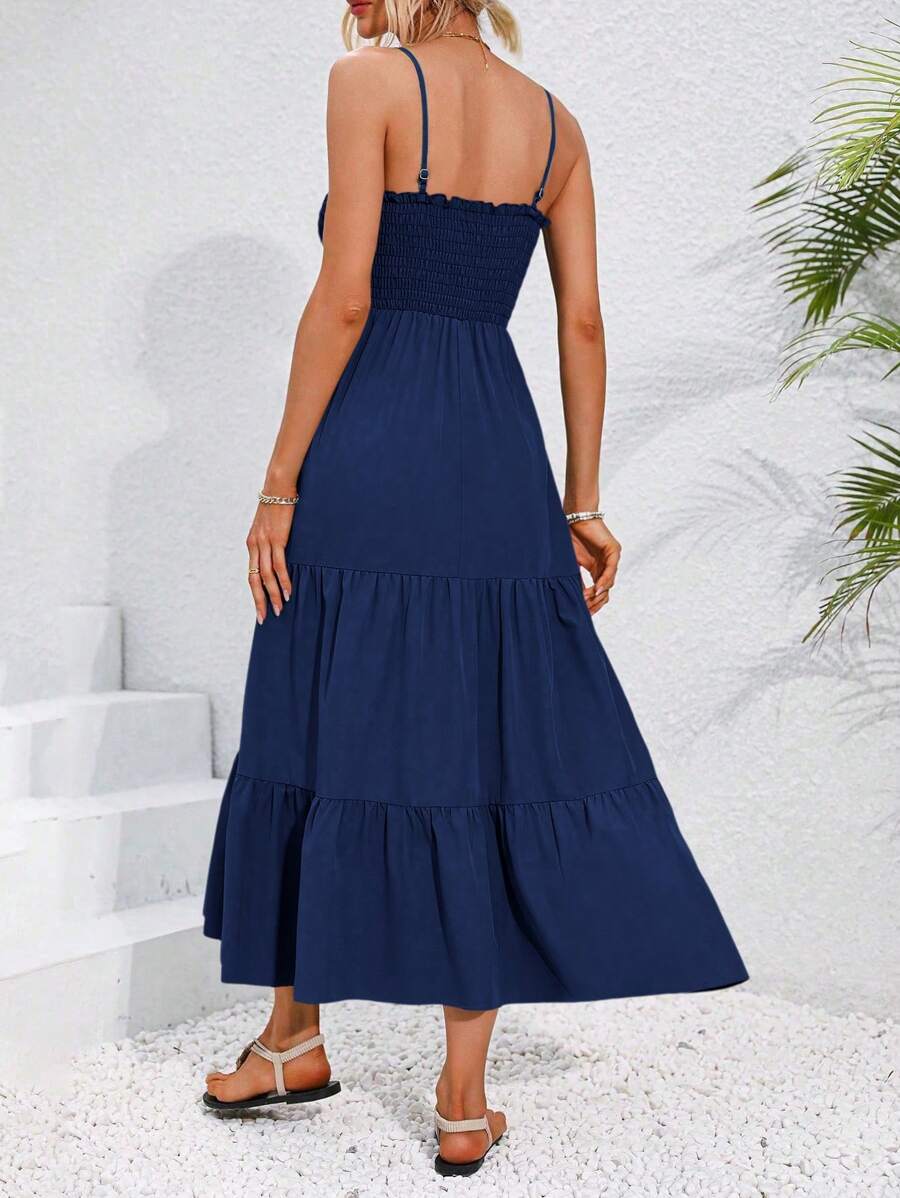 Back view navy smocked tiered maxi sundress with gathered tiers