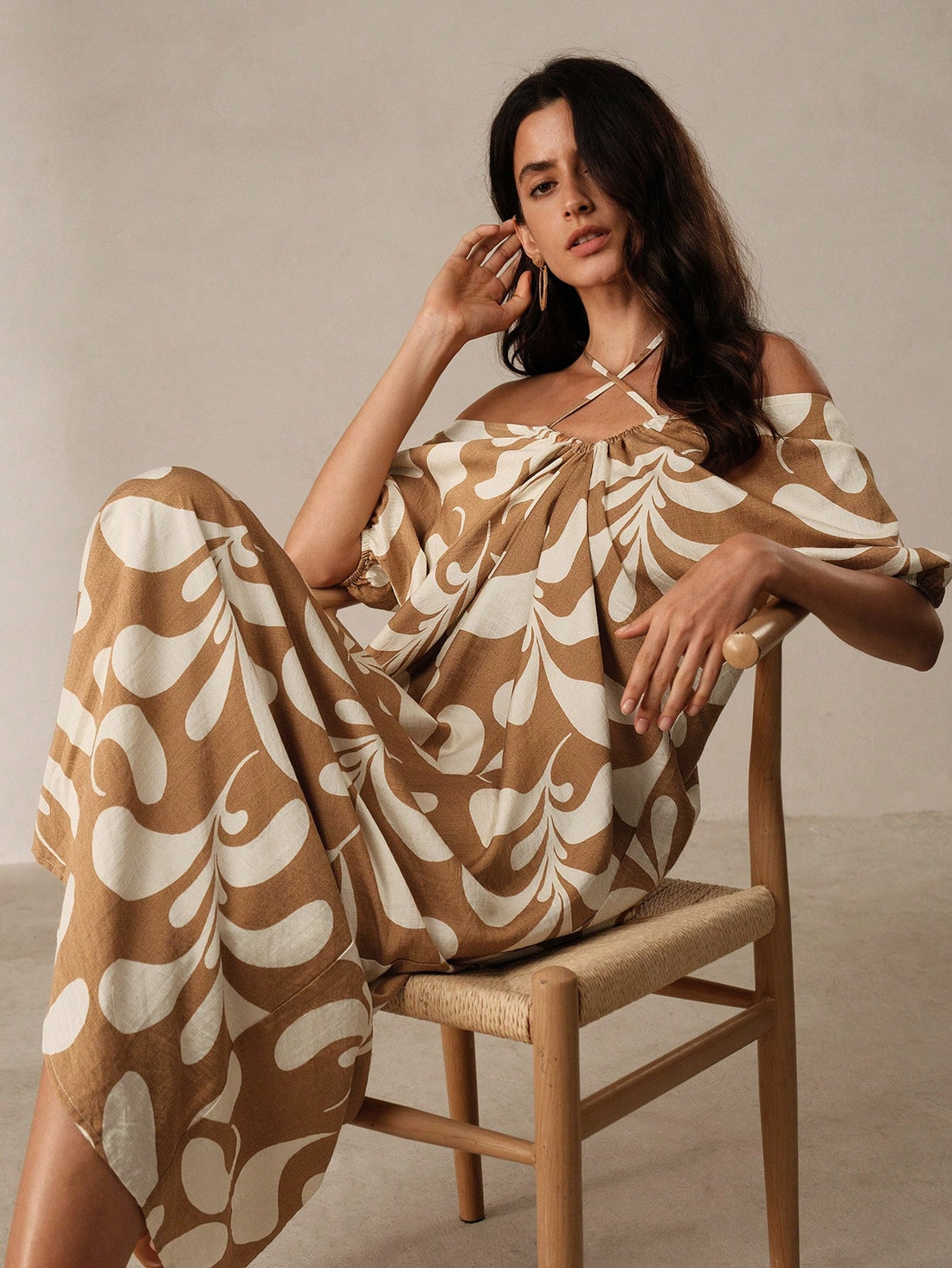 The Floral Flair dress features a playful yet elegant design with pleated details and a backless cut. Perfect for your next vacation, this dress will keep you stylish and comfortable. Expertly crafted with quality materials, it offers a flattering fit and will elevate your vacation wardrobe.