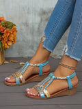 Side profile of blue embellished slingback wedge sandals showing the platform heel
