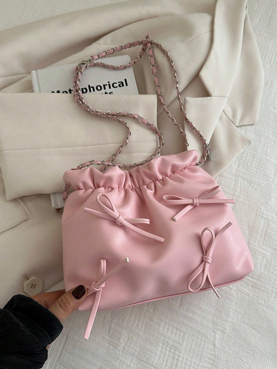 This chic shoulder bag features a solid color and stylish bowknot design, made with high-quality PU leather. Perfect for women and girls alike, this fashionable tote offers both functionality and elegance. Stay organized with its spacious interior and stand out with its sleek and modern look.