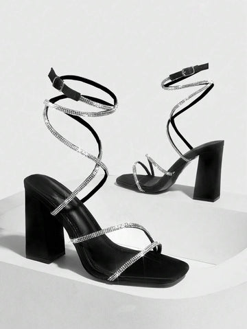black square toe block heel sandals with silver rhinestone wraparound straps, open toe, open back, ankle buckle closure, black padded insole and chunky high heel image 2
