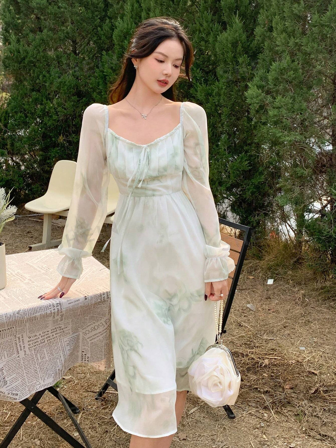 Experience the elegance and sophistication of Floral Bliss: an exquisite long dress featuring a square collar and flare sleeves. The perfect combination of style and comfort, this dress is designed to make you stand out at any event. Elevate your wardrobe with this timeless piece.