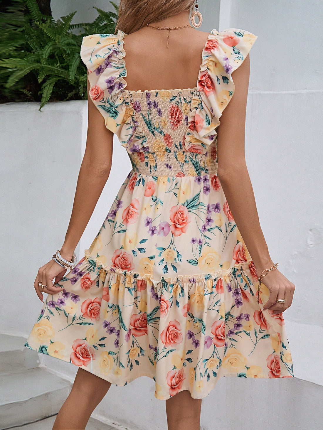 Step into summer with style in our Floral Bliss dress. The square neck and cap sleeves provide a flattering look, while the floral pattern exudes a playful charm. Made for comfort and fashion, this dress is perfect for any summer occasion.