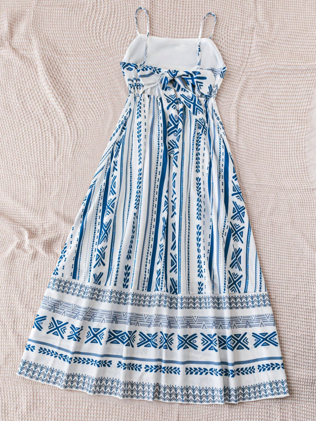 Get ready to party with our Holiday Striped Backless Cami Dress. This stylish dress features a fun and vibrant striped design that will make you stand out from the crowd. The backless design adds a touch of elegance, making it perfect for any festive occasion. Get ready to celebrate in style!