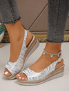 Experience fashionable and versatile style with Golden Goddess's Women's Summer Wedge Sandals. Elevate your look with these comfortable and stylish sandals, perfect for any summer occasion. With its chic design and durable construction, these sandals will become your go-to choice for both fashion and function.