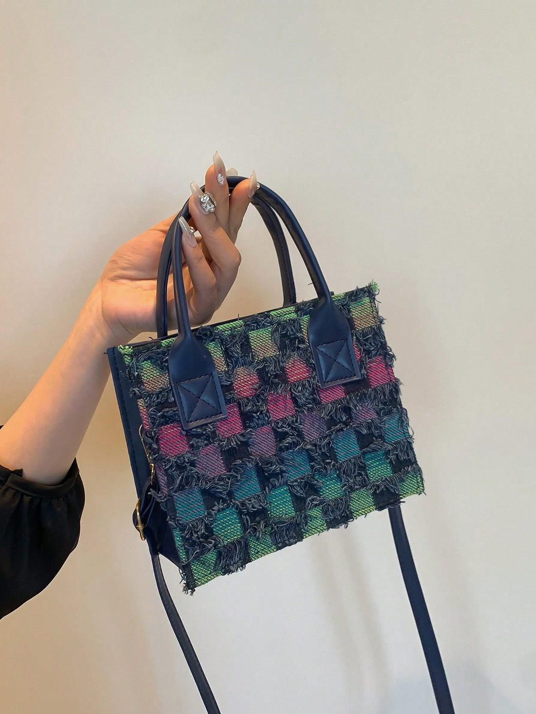 Introducing our Chic and Stylish Spring/Summer Color Block Plaid Tassel Tote Bag, a must-have accessory for any fashion-forward individual. This trendy bag features a unique color block design and playful tassel details, making it the perfect statement piece for any outfit. Stay stylish and organized with this must-have tote.