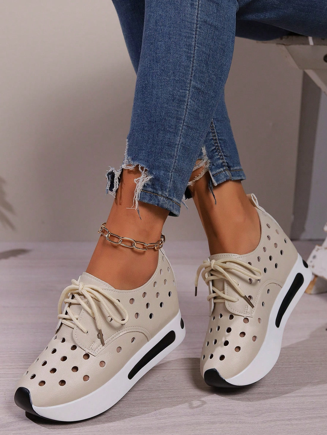 These Apricot Cutout Wedge Sneakers offer a unique combination of style and comfort. With cutout details to enhance breathability and a thick sole for added support and cushioning, these sneakers are perfect for everyday wear. Stay on trend with these fashionable and functional shoes.