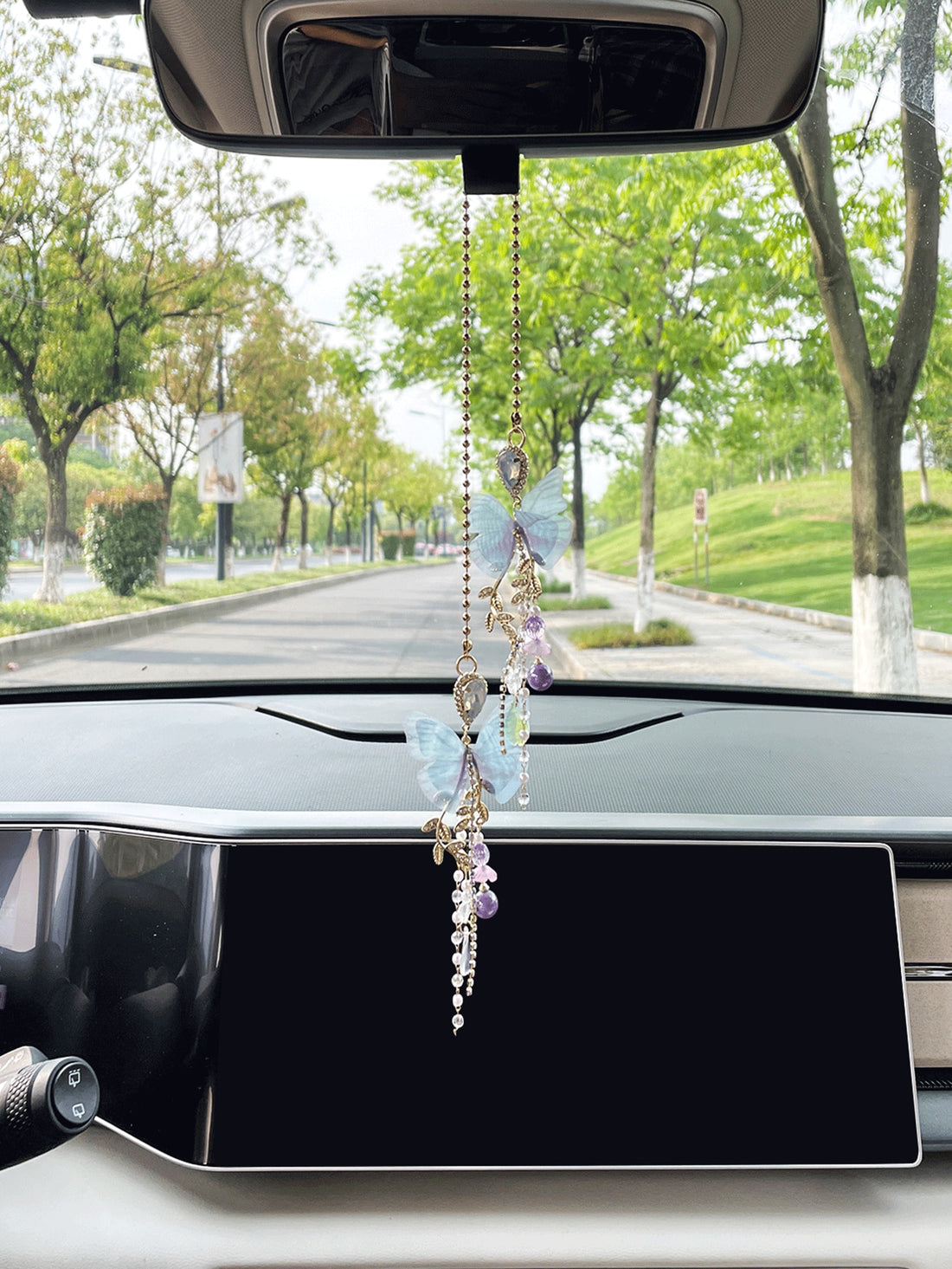 Add a touch of whimsy and elegance to your car's interior with our Fluttering Charm: Butterfly Car Pendant. The intricate butterfly design will bring a sense of wonder and beauty to your daily commute. Perfect for any woman who loves to express her unique style.
