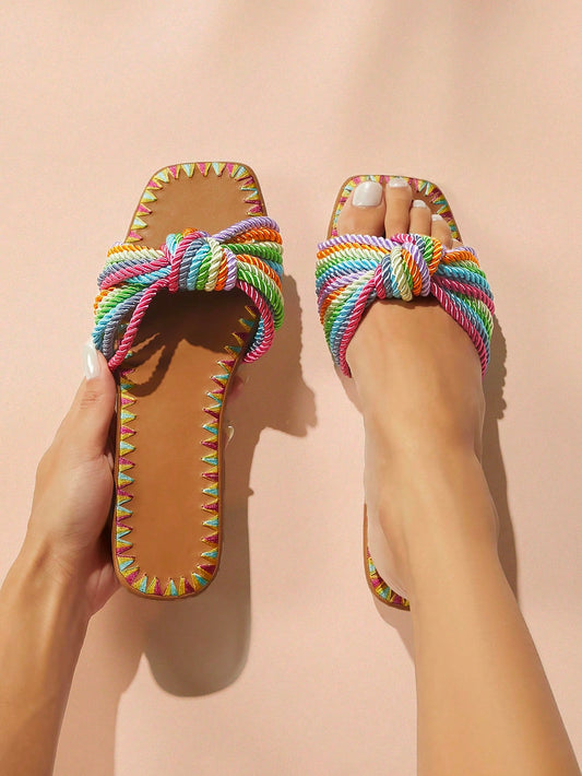 Experience effortless style and comfort this summer with our Rainbow Weave Open-Toe Sandals. The colorful weave adds a trendy touch to any outfit, while the open-toe design keeps your feet cool and comfortable. Step into the season with confidence and make a statement with every step.