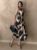 Angled full view of abstract print pleated A-line midi dress