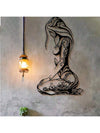 Add a touch of elegance to any room with this Graceful Kneeling Woman Modern Black Metal Wall Art. Made from high-quality metal, this piece is both durable and stylish. Its modern design features a kneeling woman, making it a unique addition to any home decor.