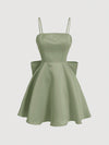 Chic Elegance: Solid Color Spaghetti Strap Dress with Back Bowknot Detail