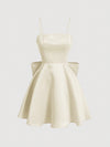 Chic Elegance: Solid Color Spaghetti Strap Dress with Back Bowknot Detail