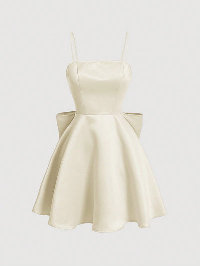 Chic Elegance: Solid Color Spaghetti Strap Dress with Back Bowknot Detail