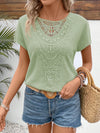 This short sleeve t-shirt features a delicate patchwork of mint green lace and a comfortable batwing style, made with waffle fabric for a soft touch. Enjoy both style and comfort with this unique piece.