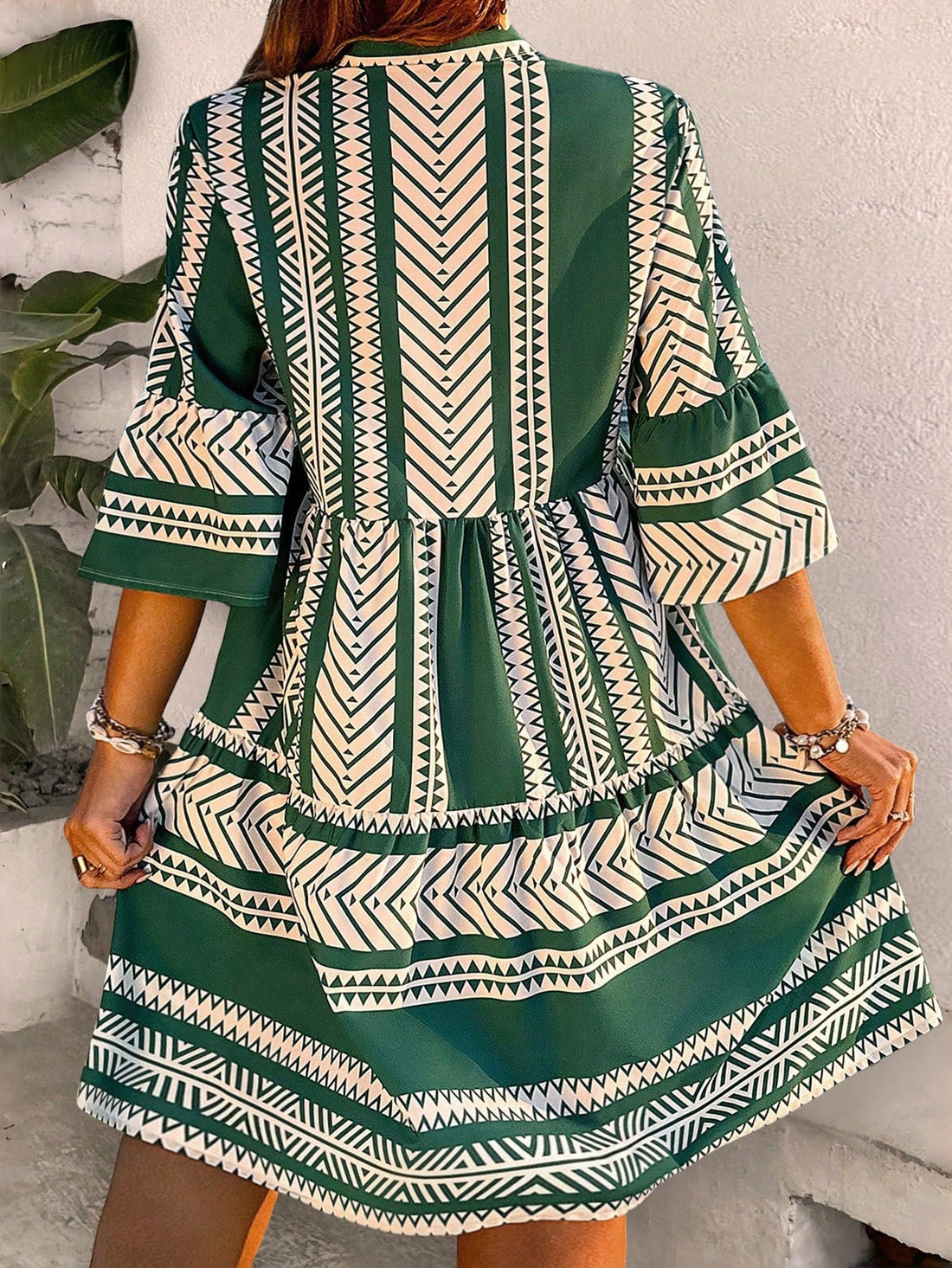 Look chic and feel comfortable in our plus size notched V-neck ruffle hem dress - ideal for your holiday escape! This versatile piece showcases your curves with a flattering neckline and adds a touch of playfulness with a ruffled hem. Perfect for any occasion, feel confident and stylish on your next getaway.