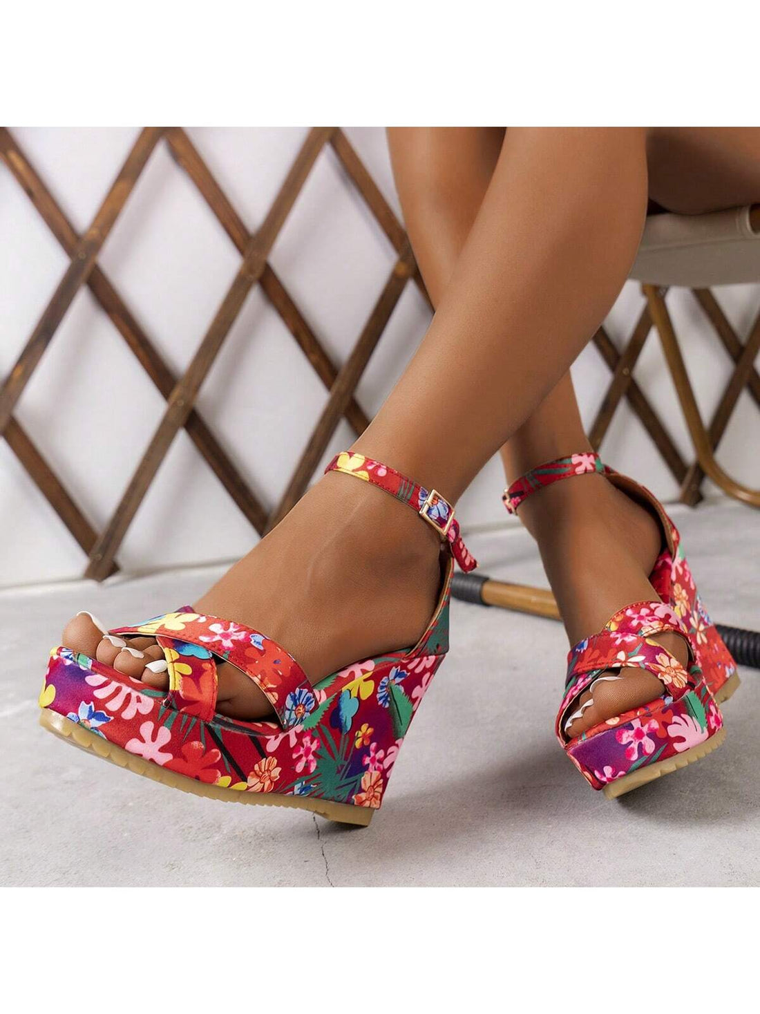 Elevate your summer style with our European and American Style Floral Wedge Sandals. Featuring a beautiful floral design and a comfortable wedge heel, these sandals will add a touch of elegance to any outfit. Perfect for a day at the beach or a night out, these sandals are a must-have for any fashion-forward individual.