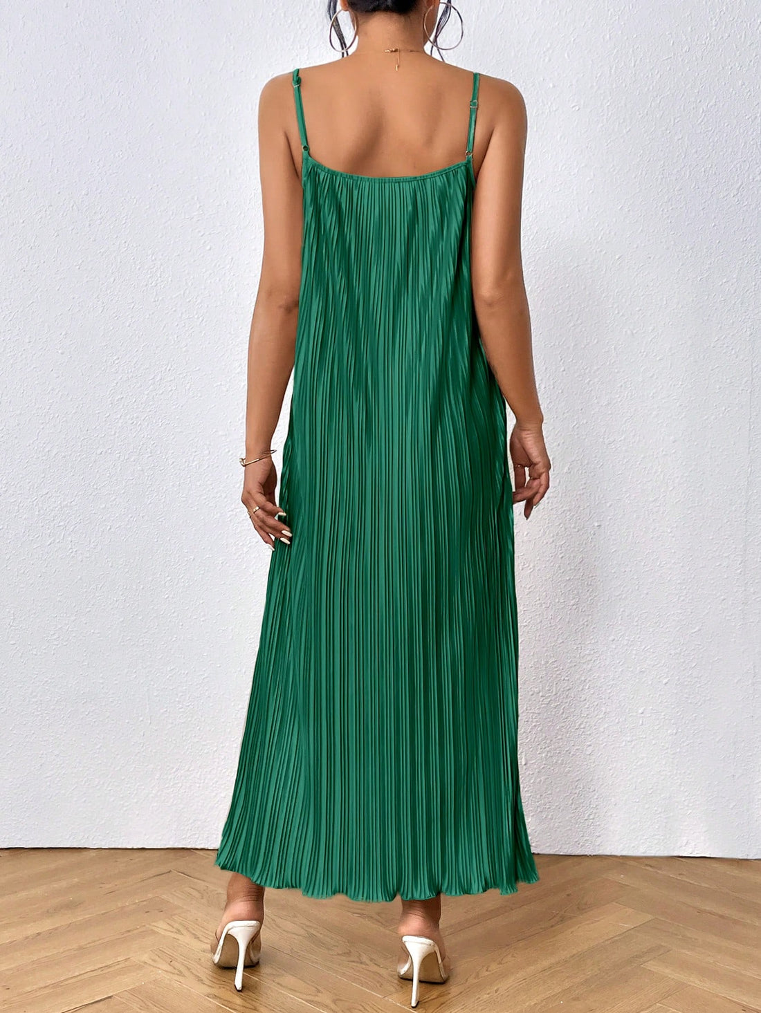 Elevate your style with the Solid Plisse Cami Dress - the perfect blend of style and comfort. This dress features an elegant design and a comfortable fit, making it perfect for any occasion. With its lightweight and breathable fabric, you'll look and feel your best all day long. 