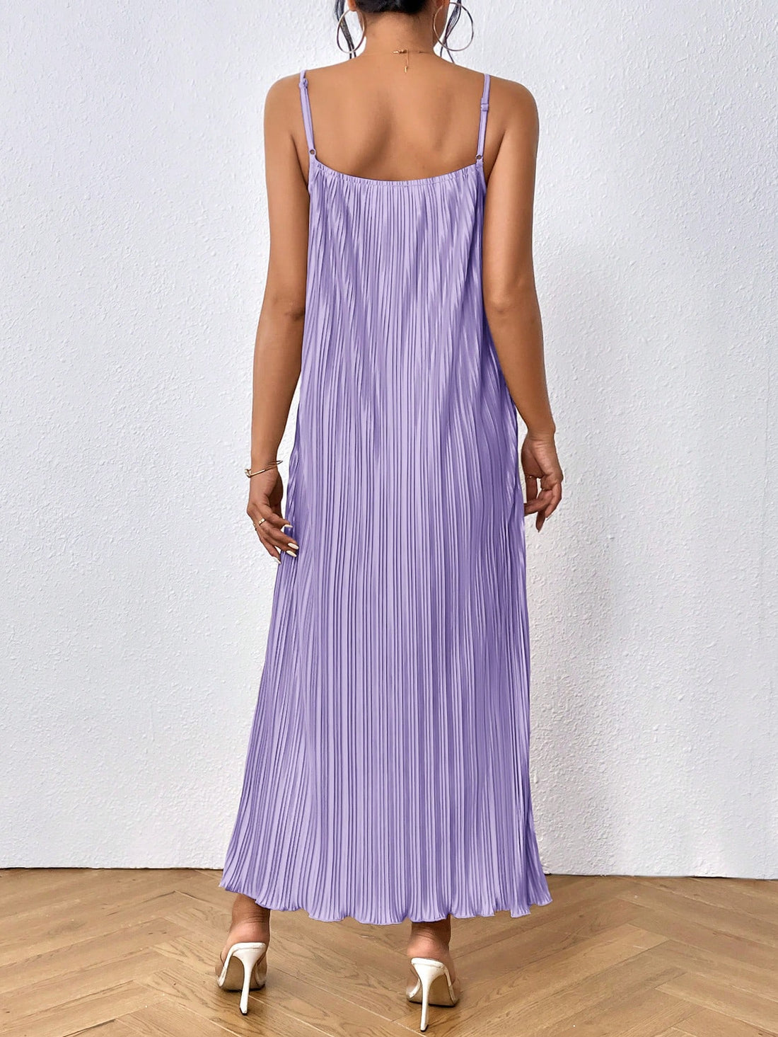 Effortlessly elevate your style with our Solid Color Cami Dress. Made with a sleek and elegant design, this dress is perfect for any occasion. With its solid color and comfortable fit, you'll look effortlessly elegant and feel confident all day long. A must-have piece for any fashion-forward wardrobe.