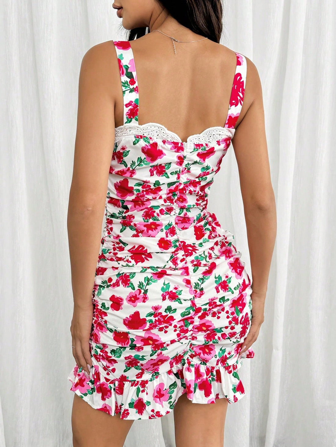 Unleash your effortless summer chic with our Floral Ruched Cami Dress. Featuring a playful floral print and ruched detailing, this dress will have you looking and feeling your best all season long. Perfect for any occasion, this dress is the epitome of fun and fashionable.