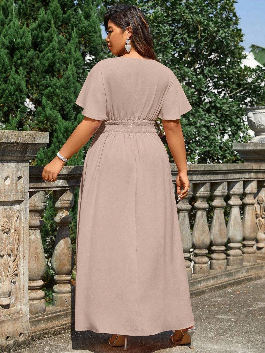 Step into summer with this Elegant Plus Size Maxi Dress designed to embrace your curves with style. Featuring a flirty overlapping V-neck and gentle ruffles, it brings a playful charm to your look. The pleated waist adds a flattering silhouette while keeping comfort front and center. Perfect for sunny days and evening gatherings, this dress blends elegance and ease in one beautiful package.