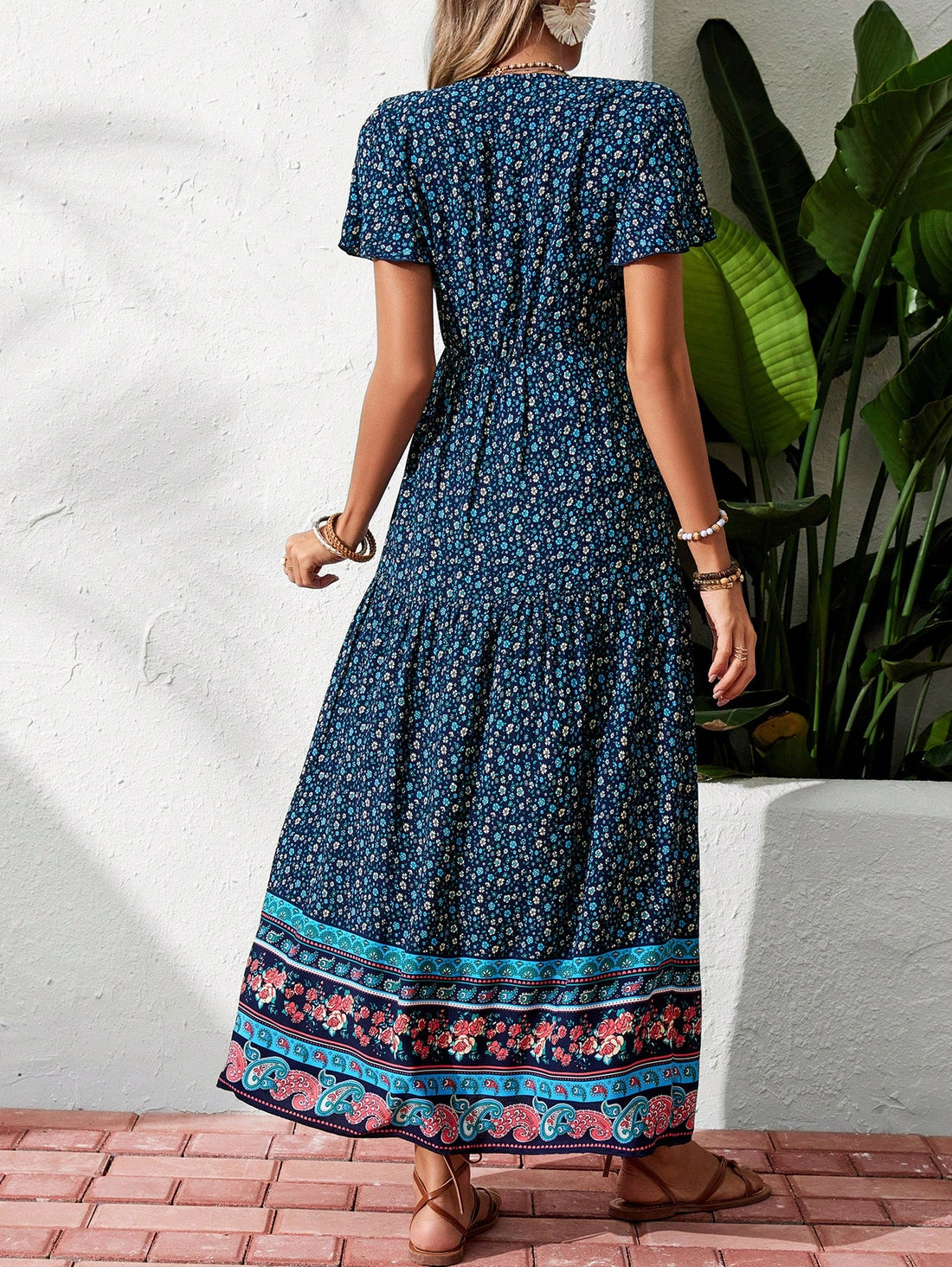 Look effortlessly chic on your next vacation or beach outing with our Women's V-Neck Flutter Sleeve Printed Maxi Dress. The delicate flutter sleeves and vibrant print make it perfect for a day at the beach or a night out. Plus, the flowy design offers comfort and breathability for those warm summer days.