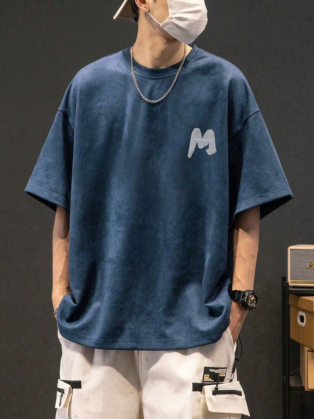 This tee is perfect for the cool and casual guy. The unique drop shoulder design adds a stylish twist to the classic graphic tee. Made with soft fabric, this tee is comfortable to wear all day long. Express yourself with the bold letter print and stand out from the crowd. (Casually cool tee with a unique drop shoulder design and bold letter print. Soft and comfy material for all-day wear.)