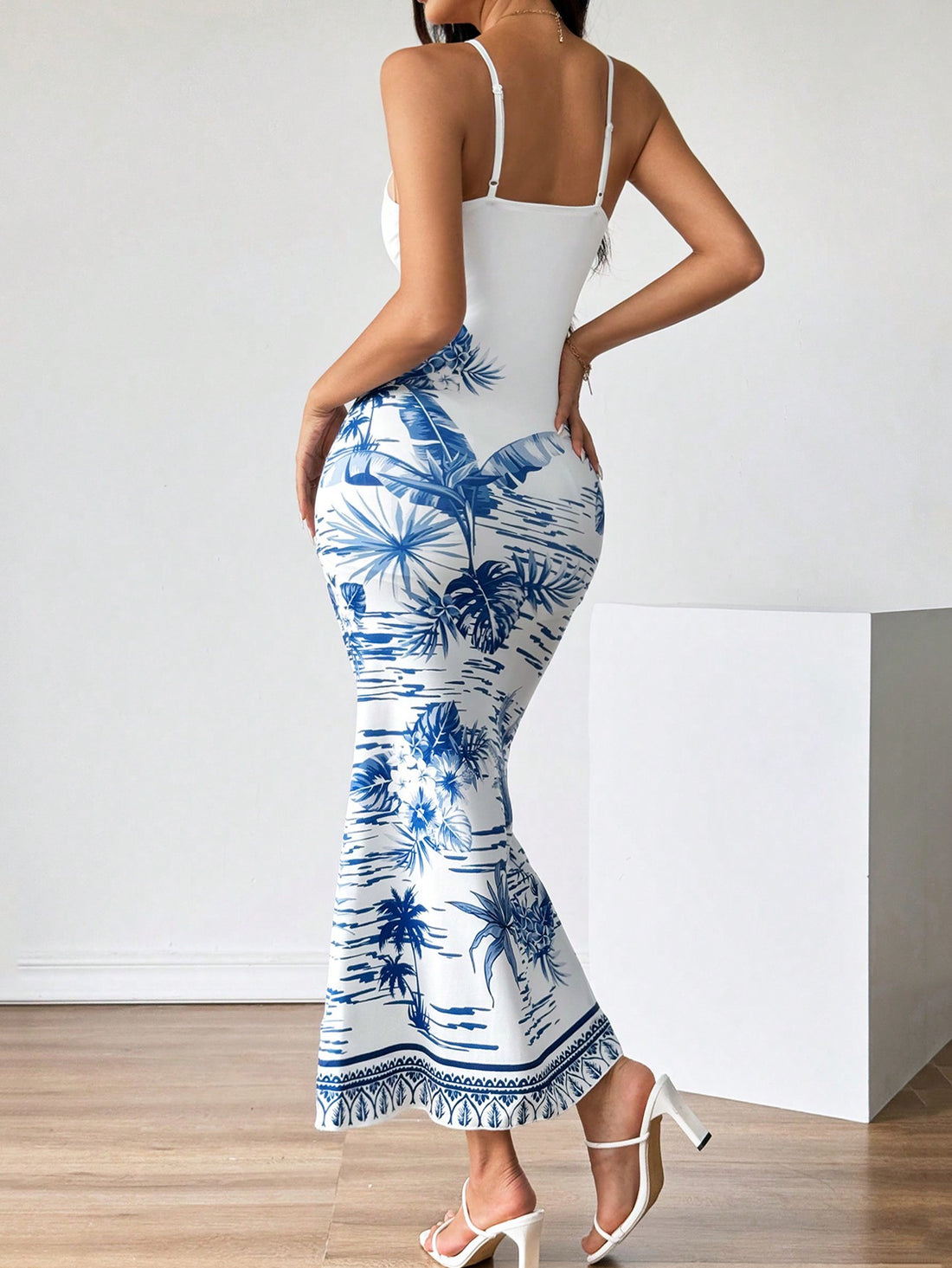 Get ready for some serious summer vibes with our Strappy Tropical Print Maxi Dress in Blue & White. Made with lightweight fabric, this dress is perfect for those hot summer days. The strappy design adds a touch of elegance, while the tropical print screams vacation mode. Stay cool and stylish this season with our Summer Vibes dress.