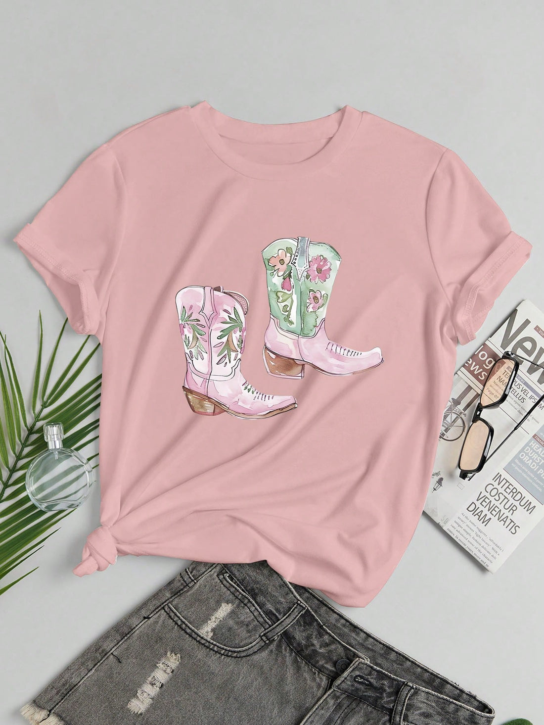 Introducing our Trendy Boot Print Summer Tee for Women. Stay stylish and comfortable this summer with our high-quality t-shirt featuring a trendy boot print design. Made with soft and breathable fabric that will keep you cool all day long. Perfect for casual outings and everyday wear.
