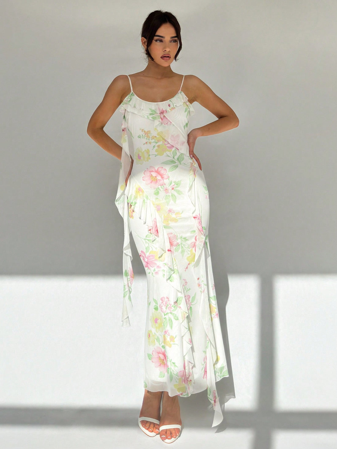 Effortlessly exude elegance and romance with our Romantic Holiday Floral Bodycon Dress. Featuring a flattering spaghetti strap design and delicate mesh panel, this dress is the perfect choice for any special occasion. Add a touch of femininity to your wardrobe with this stunning and versatile piece.