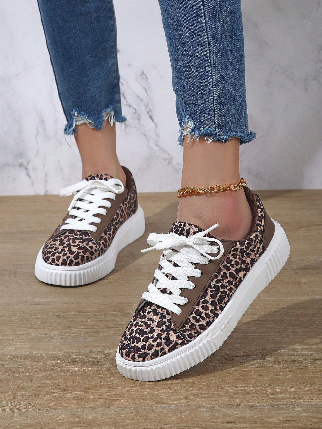 Elevate your everyday style with our Stylish Leopard Print Women’s Casual Sneakers. These comfortable lace-up athletic shoes feature a bold leopard print design that will add a touch of edginess to any outfit. Perfect for all-day wear, these shoes are a must-have for any fashion-forward woman.