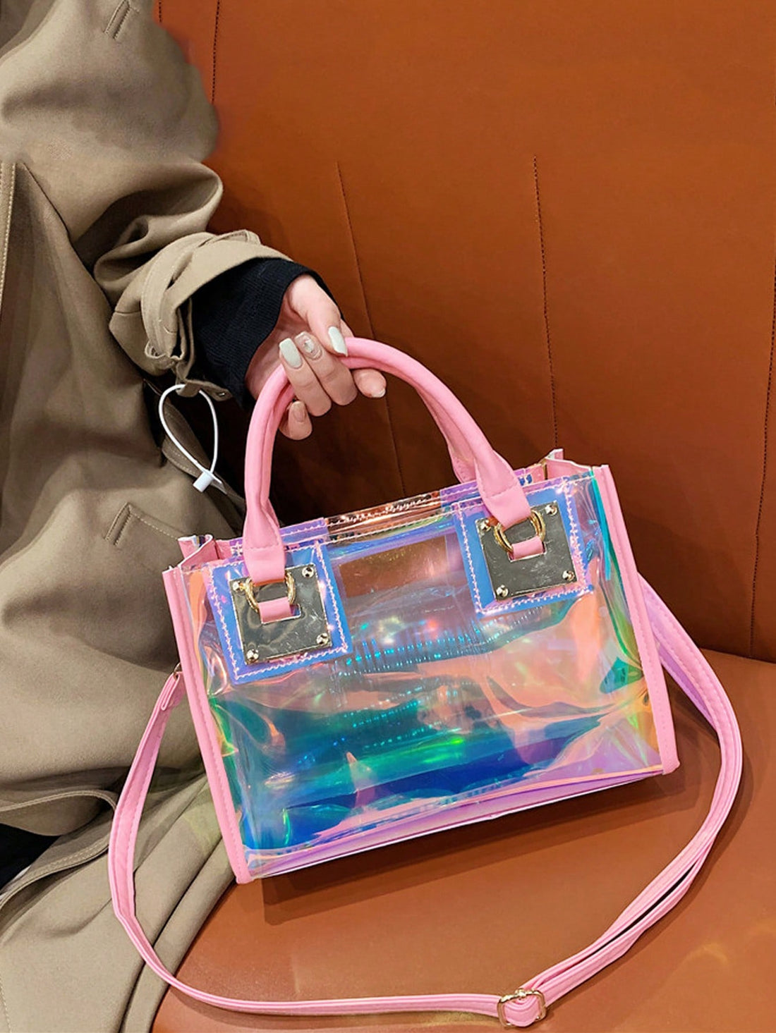 Expertly designed for fashion-forward individuals, Clear and Chic's Laser Shoulder Crossbody Handbag is both stylish and functional. Its laser-cut design offers a unique and modern look, while the included inner pouch provides extra organization. Elevate your wardrobe with this must-have accessory.