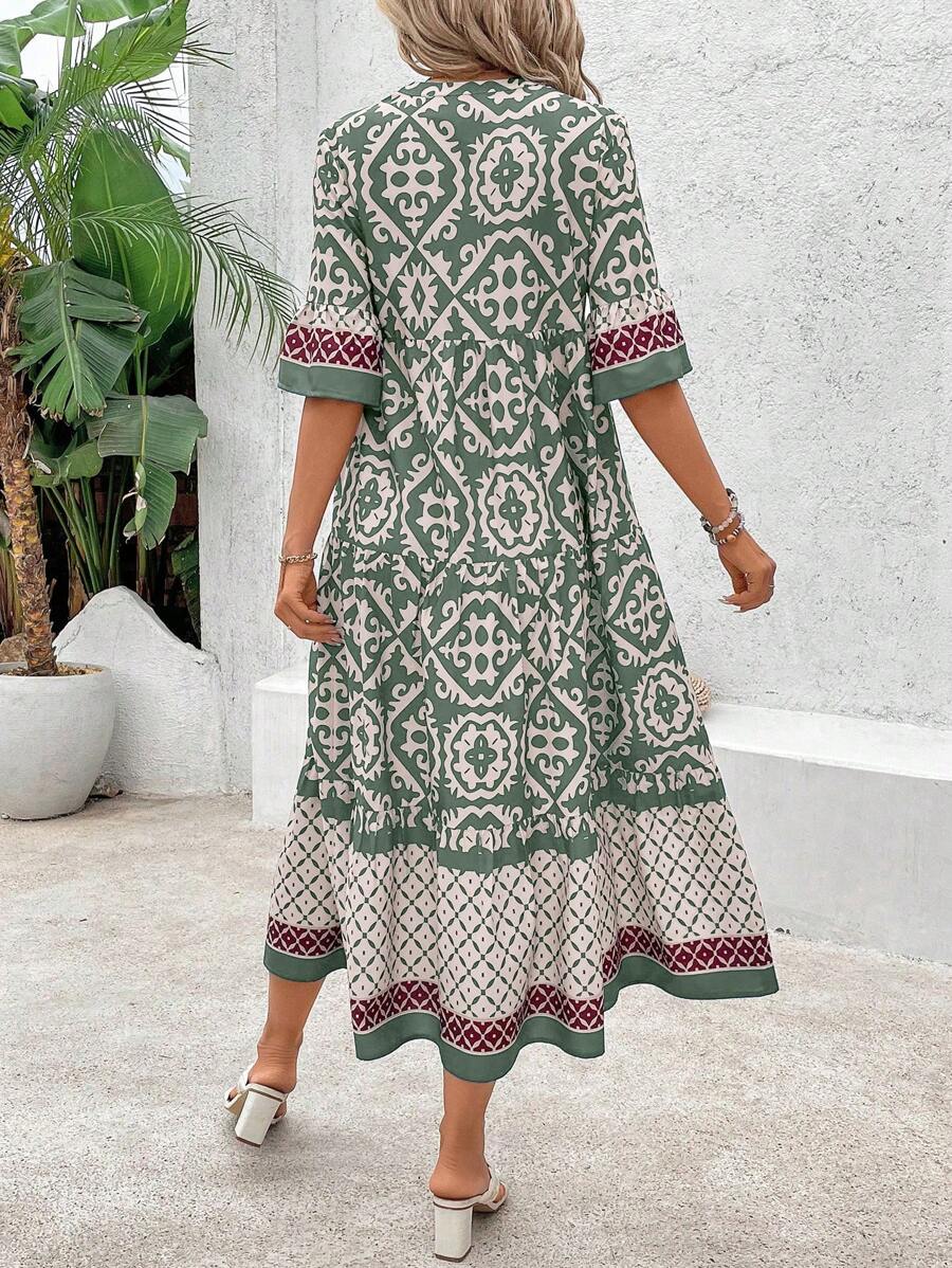 Back view of green boho printed dress with loose fit and ruffle hem