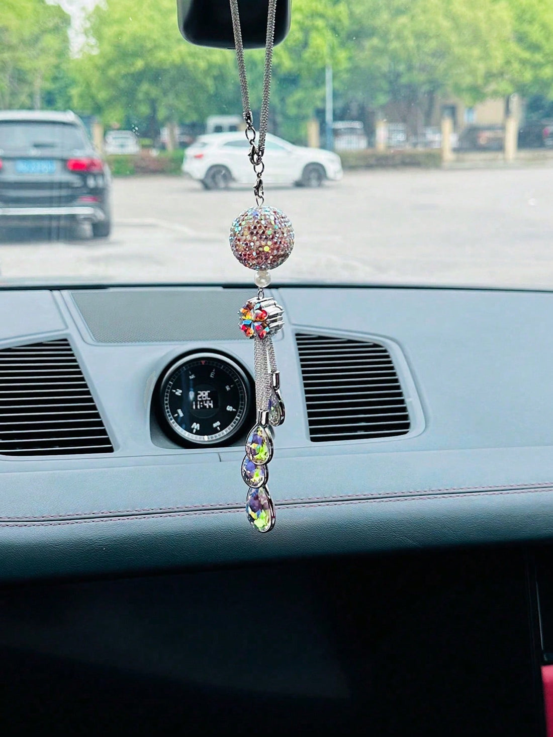 This Multicolored Gemstone Car Ornament adds a touch of luxury to your ride. Made with genuine gemstones, this ornament adds a unique and elegant touch to any vehicle. Give your car a customized look and make a statement with this ornament. Elevate your driving experience with a touch of luxury.