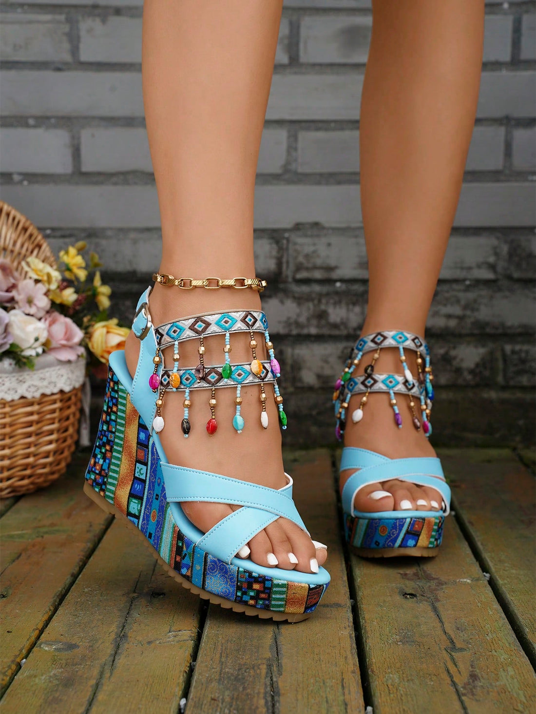 Step into summer with style in our Bohemian Wedge Sandals. The peep toe design allows for breathability while the beaded strap and tassel detail add a touch of bohemian flair. With a comfortable wedge, you'll be able to wear these sandals all season long.