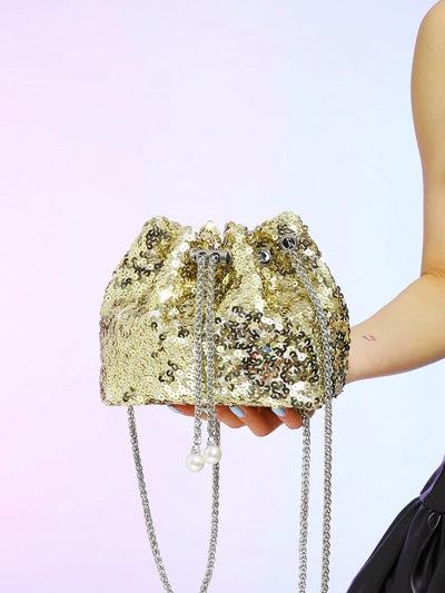 Elevate your style with our Shimmer and Shine Mini Sequin Drawstring Bucket Bag. This fashionable crossbody bag for women features a unique sequin design, adding just the right amount of sparkle to any outfit. With a convenient drawstring closure and adjustable strap, it's both stylish and practical for any occasion.